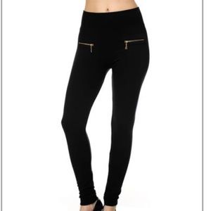 Mid-high waisted black fleece leggings with zipper